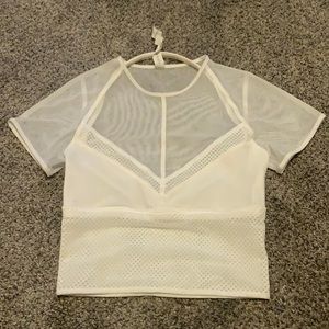 White mesh crop, built in halter bra from Lululemon’s “the Lab” line.